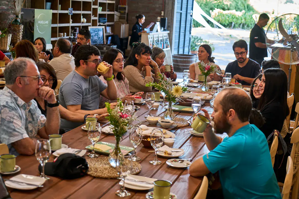 Participants share the country breakfast at the long table in the barn